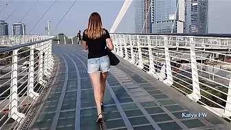 Katya takes a sexy high heels walking on the a bridge